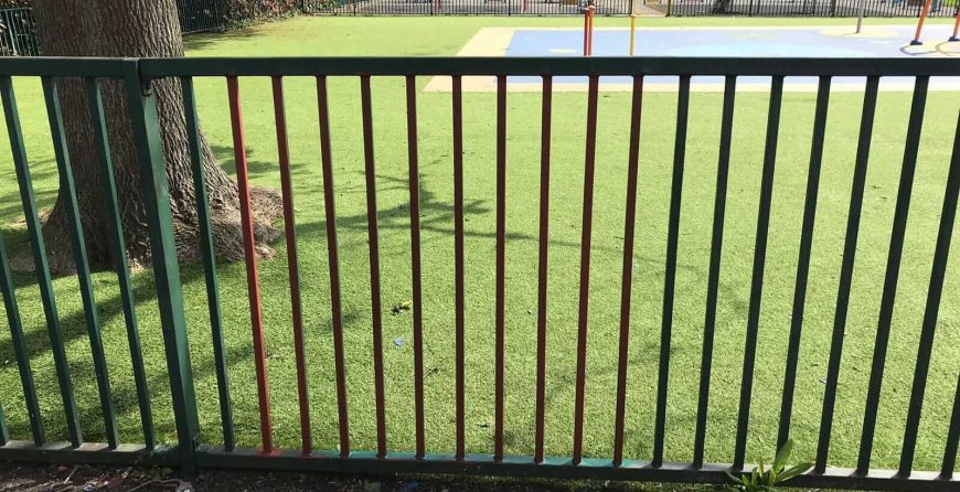 Metal fencing in playground